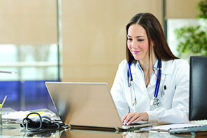 doctor checking computer