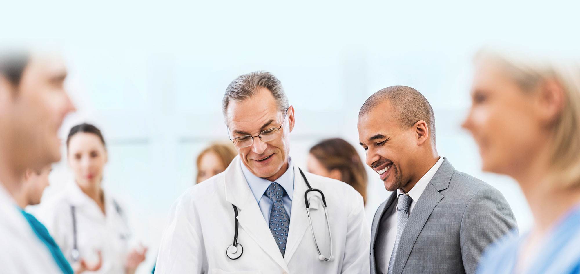 physician with office staff
