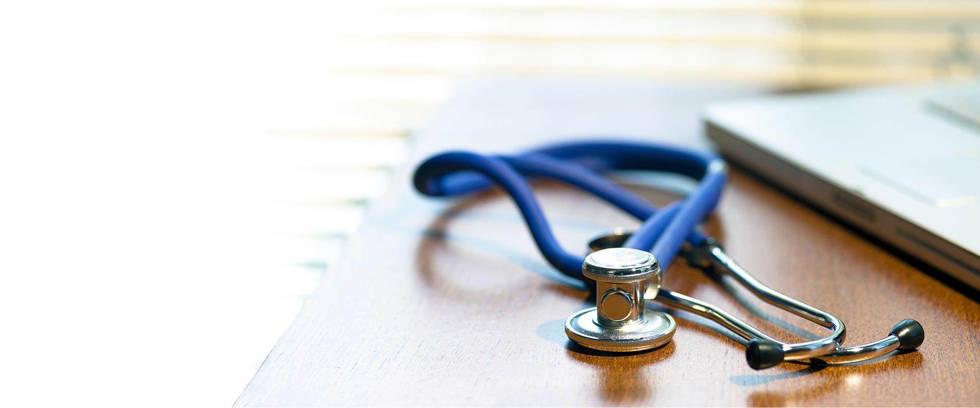 Practice Management News and Education stethoscope on desk