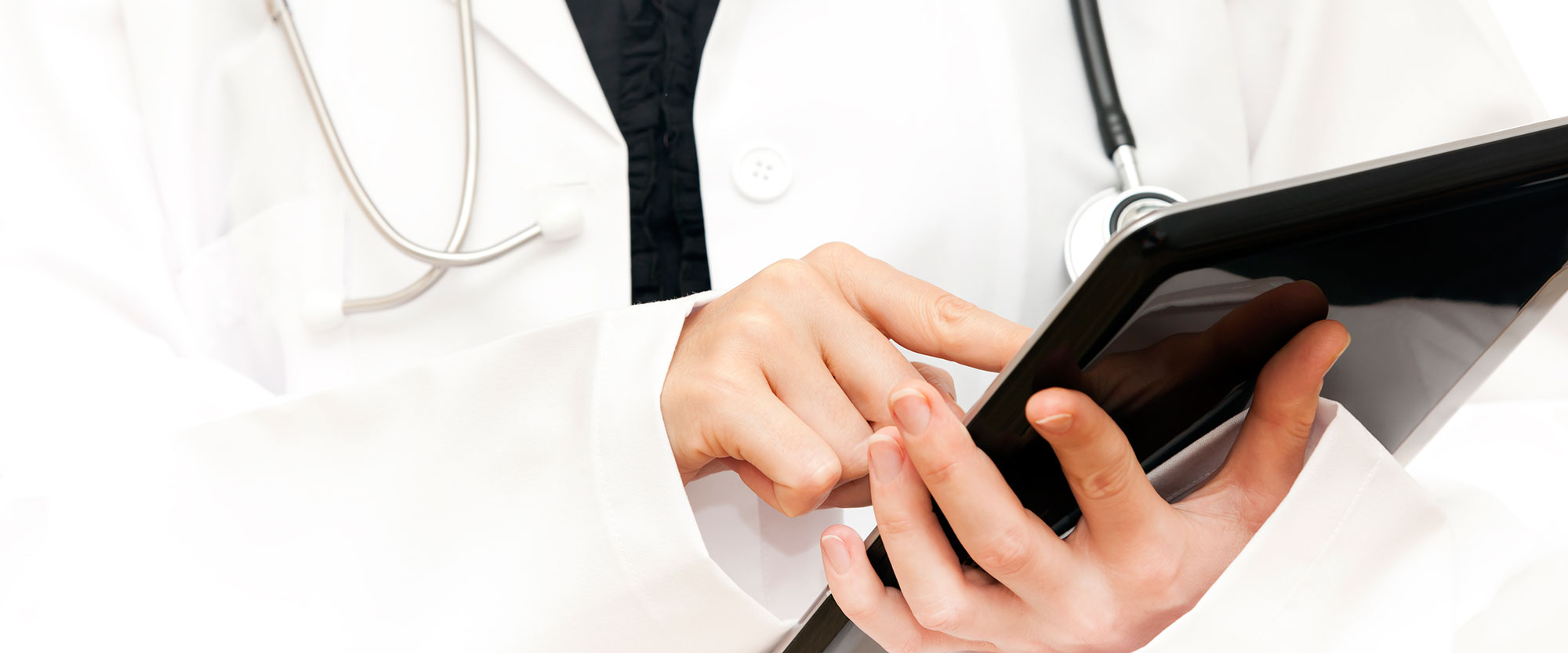 physician using tablet computer