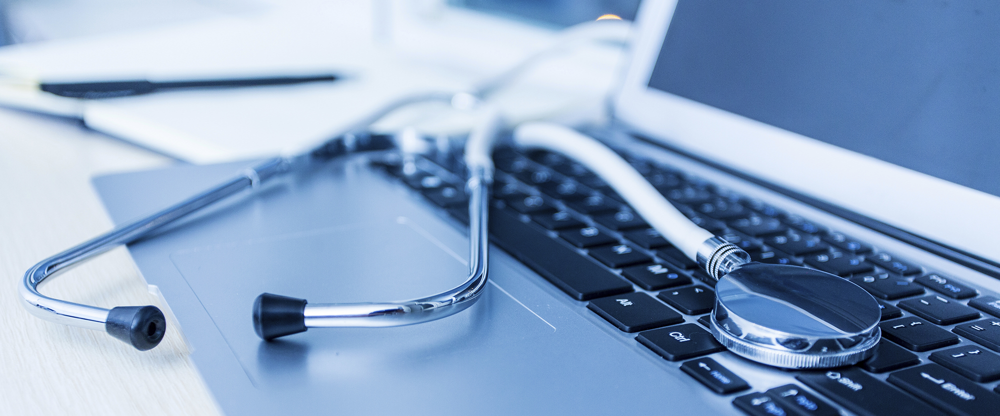 stethoscope and laptop computer