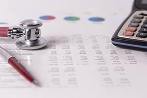 stethoscope on financial paperwork