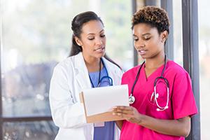healthcare professionals working on handoff communication