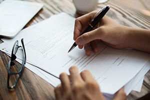 physician signing contract