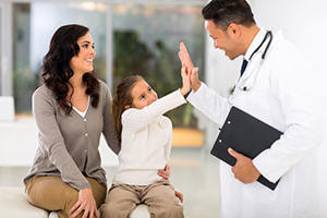 physician with patient and family