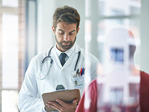 doctor looking at tablet